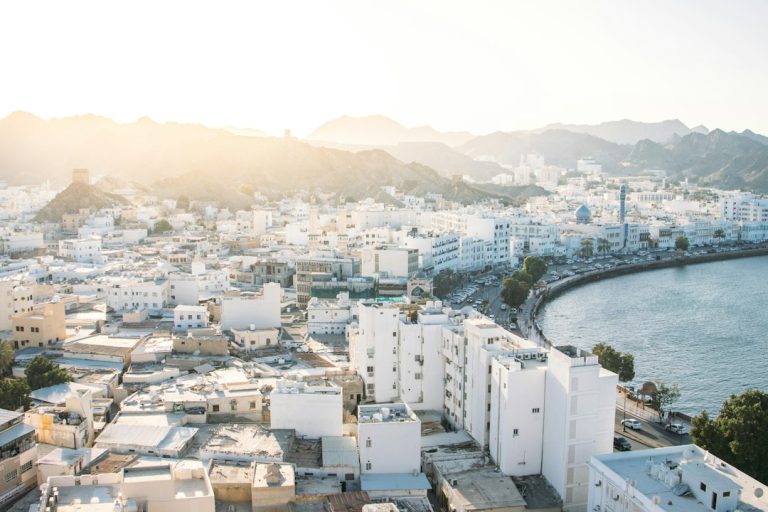 Muscat waterfront and city buildings for Oman property investment article
